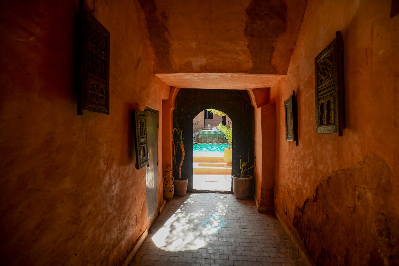 The entrance to an old building with a pool